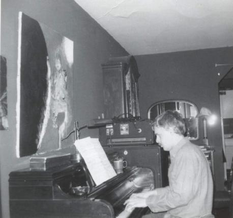 Lynn playing piano in 71st Street
      apartment